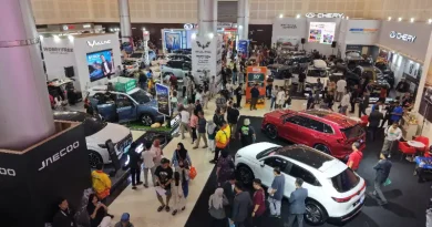 Logo IIMS Surabaya 2026 dengan latar belakang abstrak bertema pameran otomotif modern.